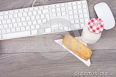 Work desk with keypad and breakfast Stock Photo