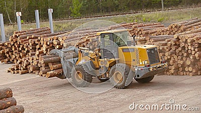 Work in a factory, work process in a woodworking factory, work on a bulldozer, yellow bulldozer in a factory. stock video Work in a factory, work process in a woodworking factory, work on a bulldozer, yellow bulldozer in a factory. stock video