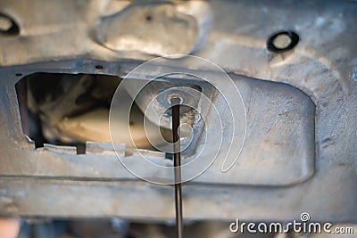 car workshop, car oil change in a garage by a car mechanic Stock Photo