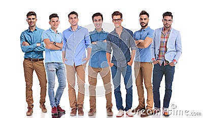 Work group of seven hapy casual men standing Stock Photo