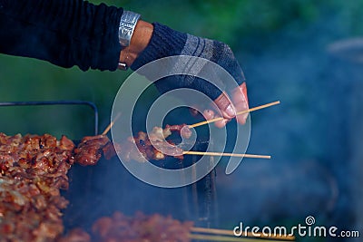 Work hand,grilled pork. Stock Photo