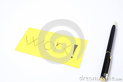 Work handwrite with a pen on a yellow paper Stock Photo