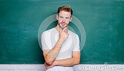 Work hard play harder. student man in classroom. man at blackboard. get knowledge here. online courses. education abroad Stock Photo