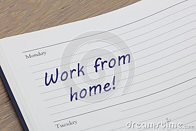 Work from home diary reminder appointment open on desk Stock Photo