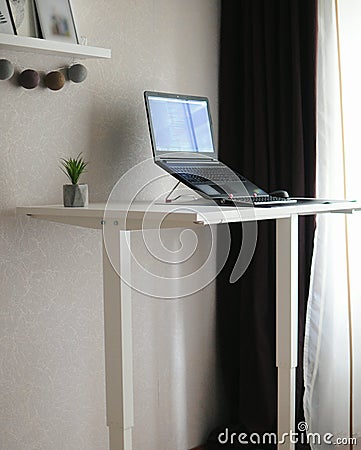 Work home place with standing table. Remote job in cozy place Stock Photo