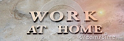 WORK AT HOME , writen wooden letters on stone background Stock Photo