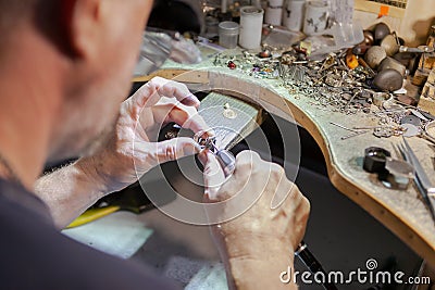 Work of the master, jeweler. Jewelry repair shop. Manufacturing of jewelry Stock Photo