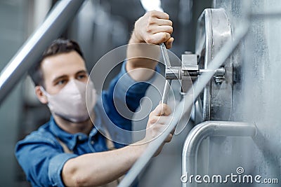 Work in plant of brewery observing process of brewing and fermentation, production of beer Stock Photo