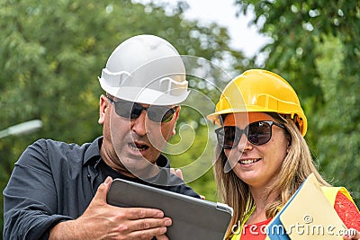 Receiving bad news on construction site Stock Photo