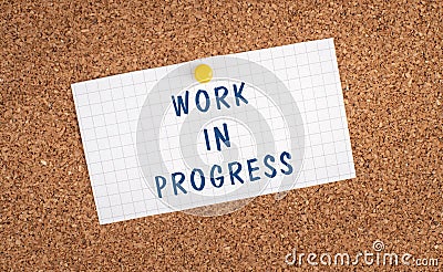 Work in progress is standing on a pinned paper, construction message, laber day, text note Stock Photo