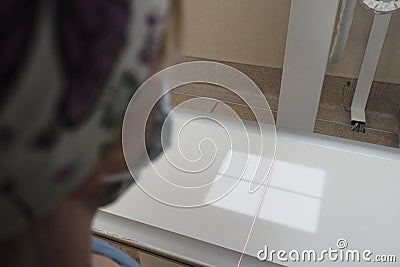 The work of a radiologist in the X-ray room for diagnostics. Stock Photo