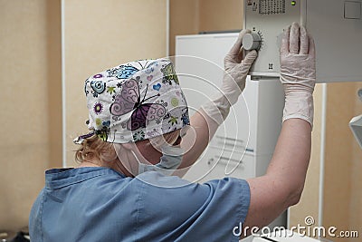 The work of a radiologist in the X-ray room for diagnostics. Stock Photo