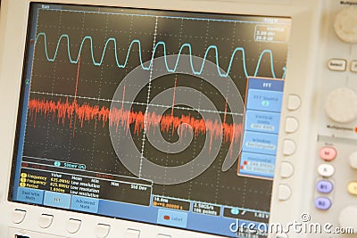 The work of a scientist. The computer monitor shows various curves. Stock Photo