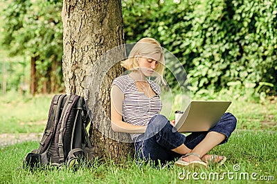 Work in summer park. Girl work with laptop in park. Reasons why you should take your work outside. Lunch time relax or Stock Photo