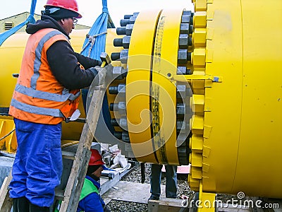 Work tighten the nuts on the flange Stock Photo