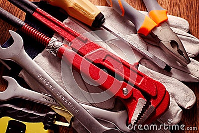 Work Tools on Hand Gloves Placed on a Table Stock Photo