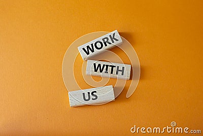 Work with us symbol. Wooden blocks with words Work with us. Beautiful orange background. Business and Work with us concept. Copy Stock Photo