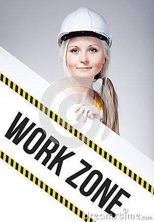 Work zone sign placed on information board, worker woman Stock Photo