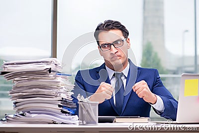 The workaholic businessman overworked with too much work in office Stock Photo