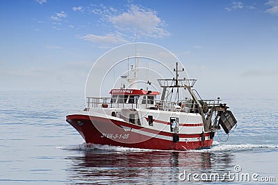 Trawler fishing boat in open waters in course to La Vila port. Editorial Stock Photo