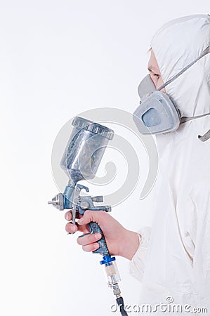Worker with airbrush gun Stock Photo