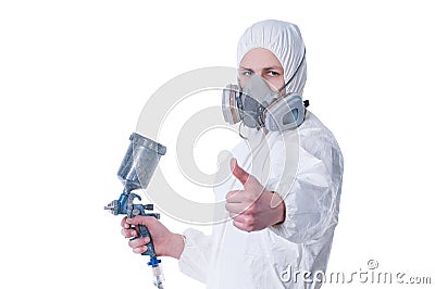 Worker with airbrush gun giving thumbs up Stock Photo