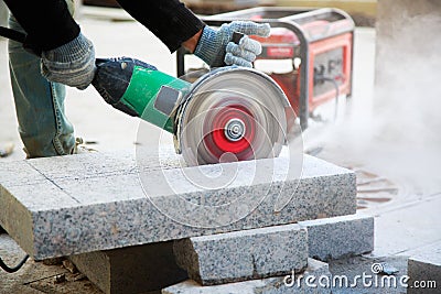 Worker with angle grinder Stock Photo