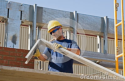 Worker Bending Metal Stock Photo