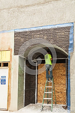 Worker on a building at San Pedro Square,San Jose Editorial Stock Photo