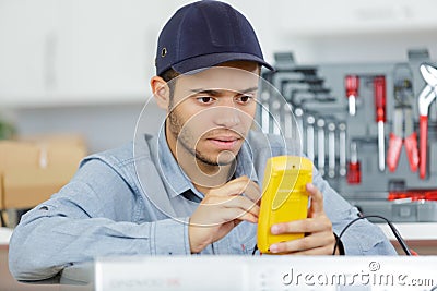 worker calibrating machine Stock Photo