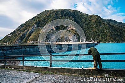 Worker carries repair work on the Enguri hydroelectric dam HES Stock Photo