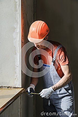 Worker is checking the correctness of the installation of a wind Stock Photo