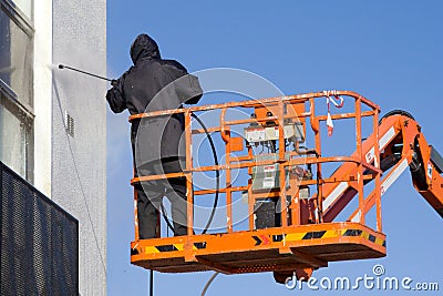 A worker in a cherry-picker Stock Photo