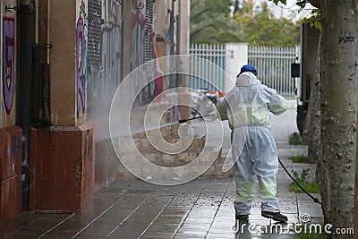 A worker of the cleaning and disinfection brigade seen during the COVID-19 outbreak in the island of Mallorca Editorial Stock Photo