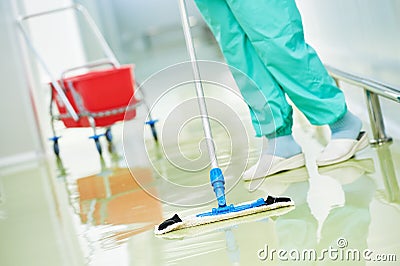 Worker cleaning floor with machine Stock Photo