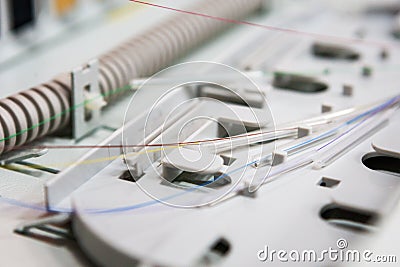 Worker comunicate fiber optic cable at opto box. installing new network equipment Stock Photo