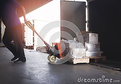 Worker Courier Unloading Package Boxes from Cargo Container. Delivery Truck. Loading Dock Warehouse. Cargo Shipments. Stock Photo