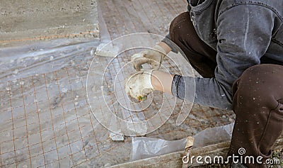 A worker creates a form for pouring concrete Stock Photo