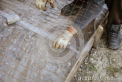 A worker creates a form for pouring concrete Stock Photo