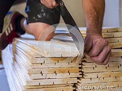 worker cuts wooden slats Stock Photo