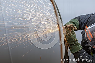 The worker is cutting to metal plate with manual flame cutting process. Oxy-fuel welding, oxyacetylene welding, oxy welding. Stock Photo