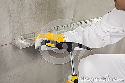 Worker fixing a dowel Stock Photo