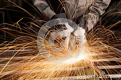 Worker grinding Stock Photo