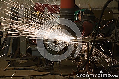 Worker grinding Stock Photo