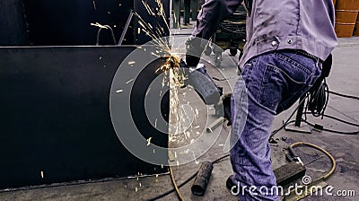Worker are grinding metal steel Stock Photo