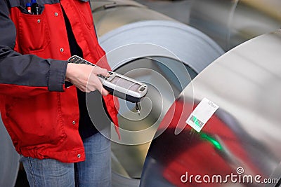 A worker has scanned steel roll production Stock Photo