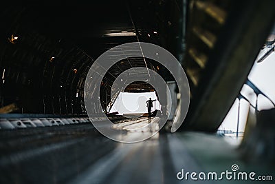 Worker inside a huge empty Antonov airplane Stock Photo