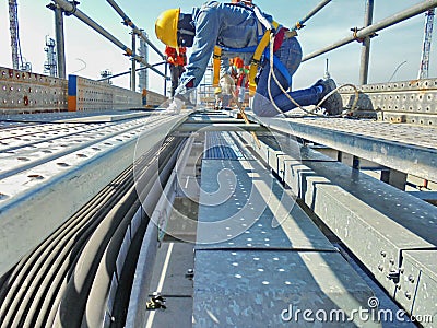 Worker are installing cable tray Stock Photo