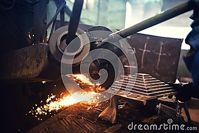 Worker, laborer cutting and grinding steel using grinder power tool Stock Photo
