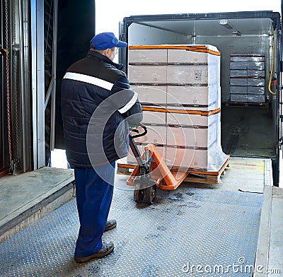 Worker loading on truck Stock Photo